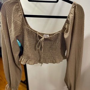 Le Lis tan long sleeve cropped top.